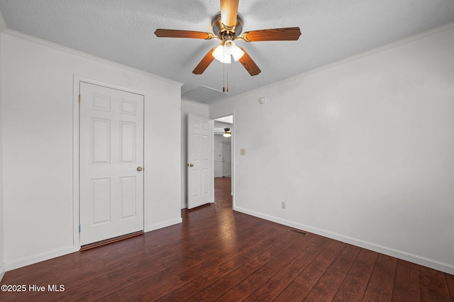 unfurnished bedroom featuring ceiling fan, ornamental molding, dark hardwood / wood-style floors, and a textured ceiling