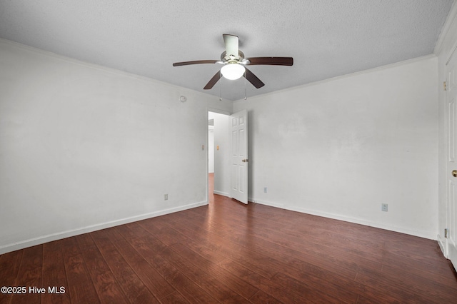 empty room with dark wood-type flooring, ceiling fan, ornamental molding, and a textured ceiling