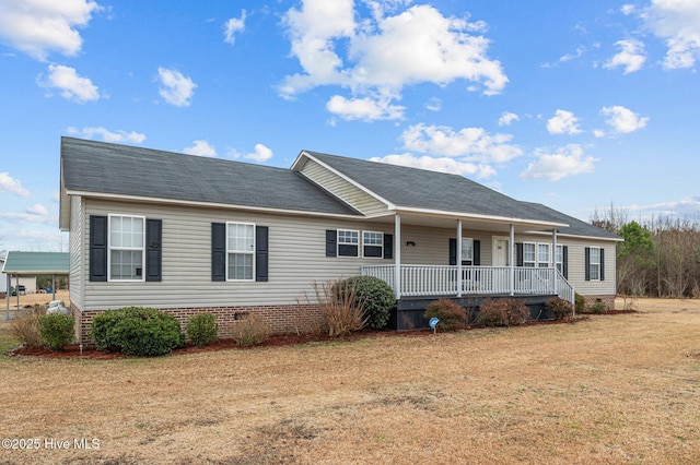 single story home featuring covered porch and a front lawn