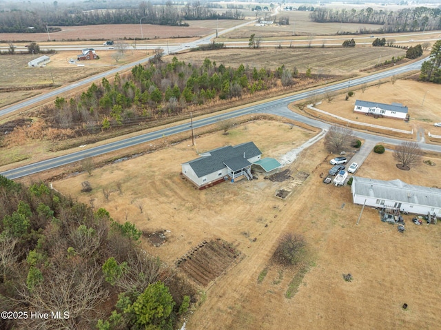 birds eye view of property featuring a rural view