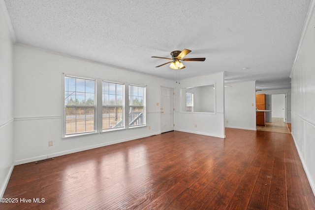 unfurnished living room featuring dark hardwood / wood-style flooring, a textured ceiling, and ceiling fan