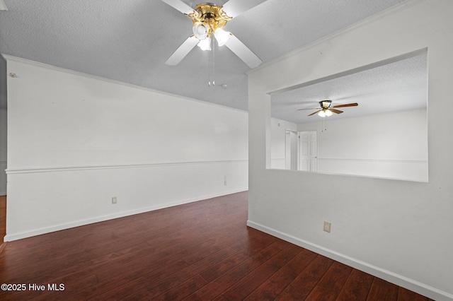 spare room with ceiling fan, dark hardwood / wood-style floors, and a textured ceiling