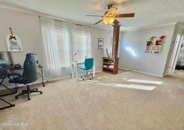 carpeted home office with ceiling fan, a textured ceiling, and ornamental molding