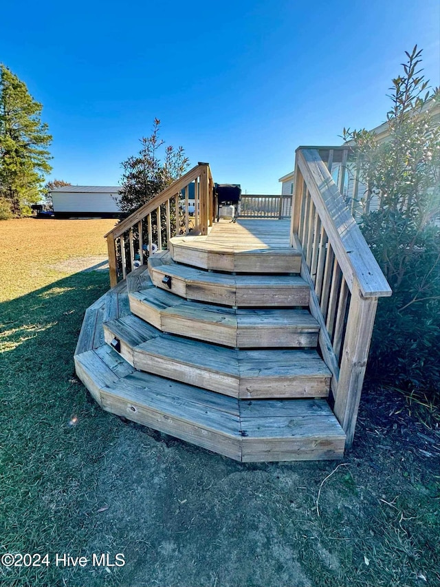 wooden deck with a yard