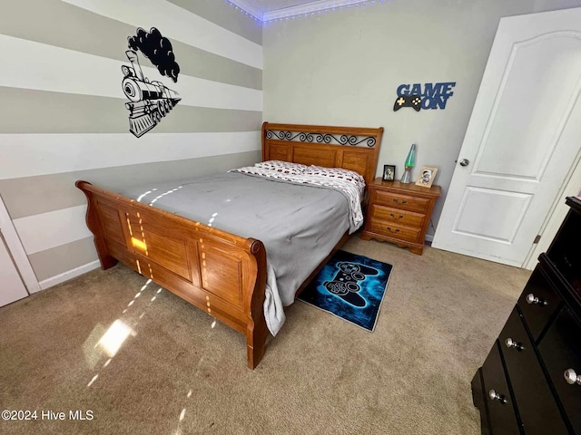 carpeted bedroom featuring crown molding