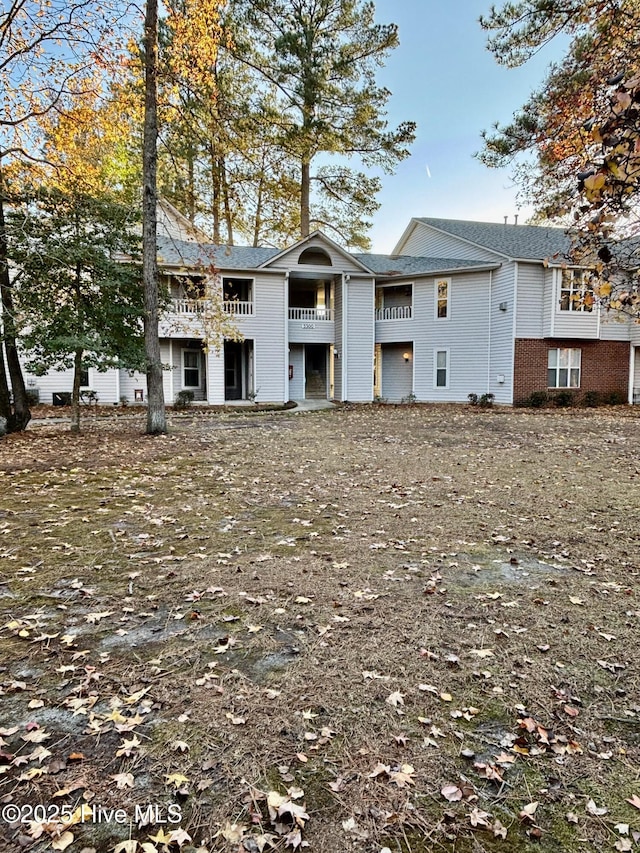 view of front of house with a balcony