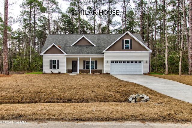 craftsman house featuring covered porch and a garage