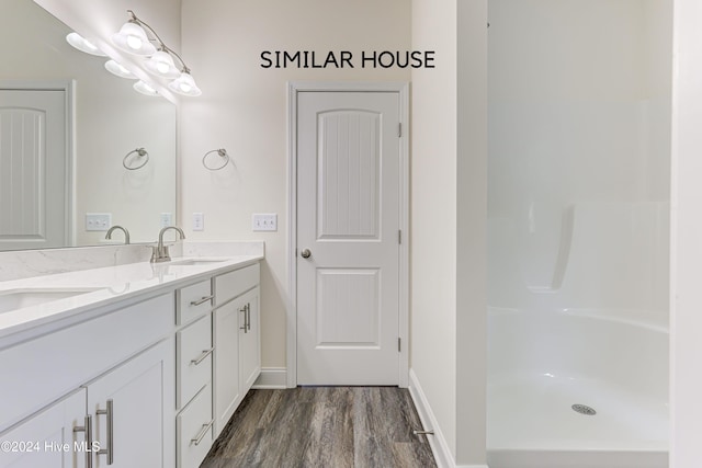 bathroom featuring vanity and wood-type flooring