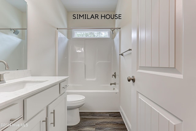 full bathroom featuring hardwood / wood-style flooring, vanity, toilet, and shower / tub combination