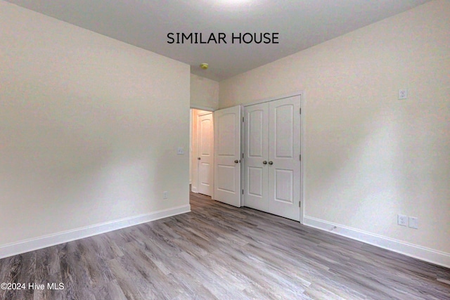 unfurnished bedroom featuring light wood-type flooring