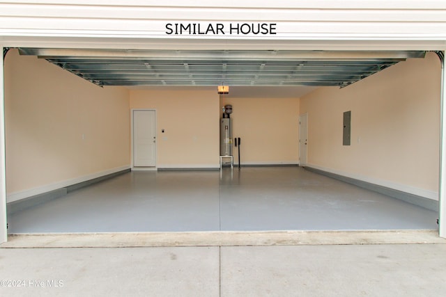 garage with electric panel and water heater