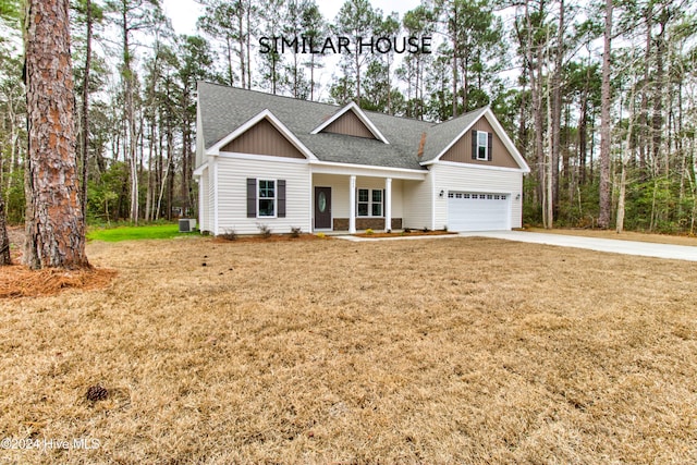 craftsman-style house featuring a porch, a front yard, and central AC