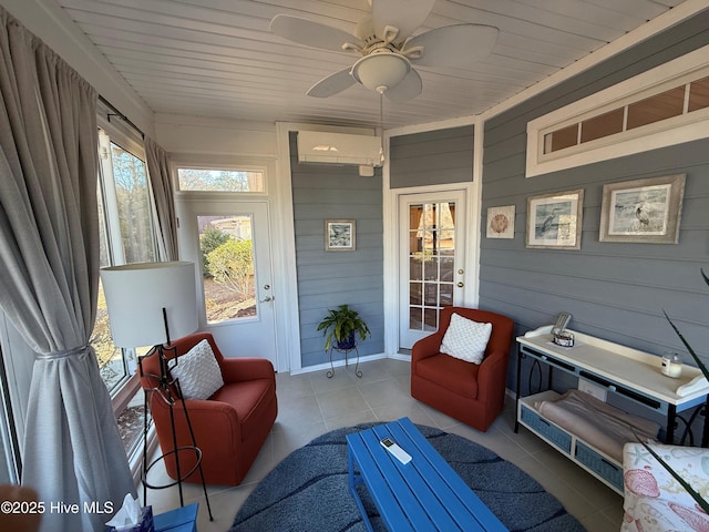 sunroom with ceiling fan, a healthy amount of sunlight, and a wall unit AC