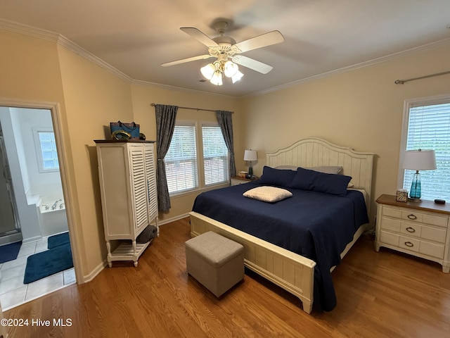 bedroom with ceiling fan, crown molding, ensuite bathroom, and light hardwood / wood-style flooring