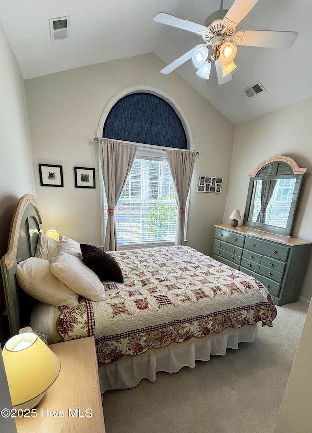 bedroom with carpet flooring, ceiling fan, and lofted ceiling