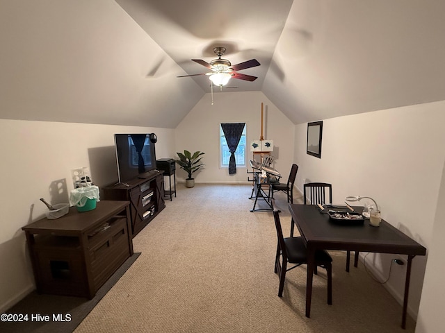 carpeted office featuring ceiling fan and lofted ceiling