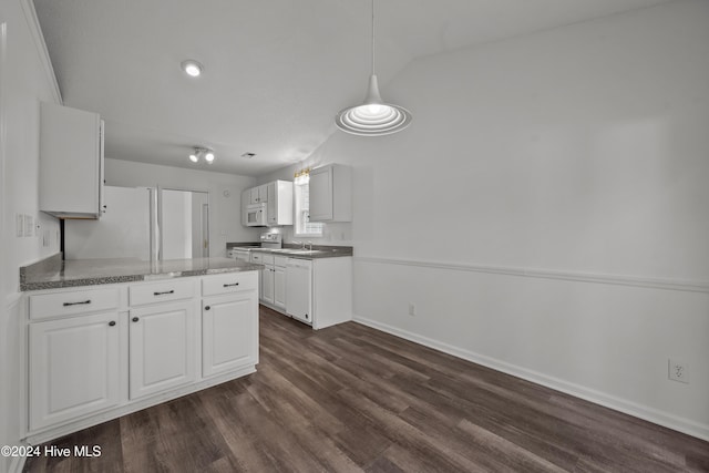 kitchen with white cabinets, white appliances, dark hardwood / wood-style flooring, and vaulted ceiling