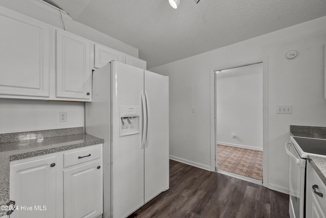 kitchen featuring white cabinets, a textured ceiling, white appliances, and dark hardwood / wood-style floors