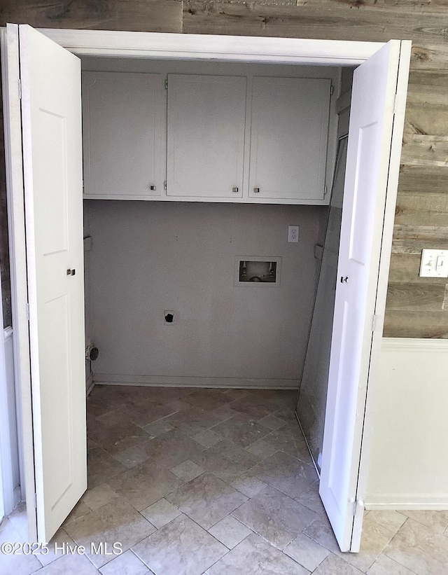 washroom featuring cabinets, washer hookup, electric dryer hookup, and wood walls