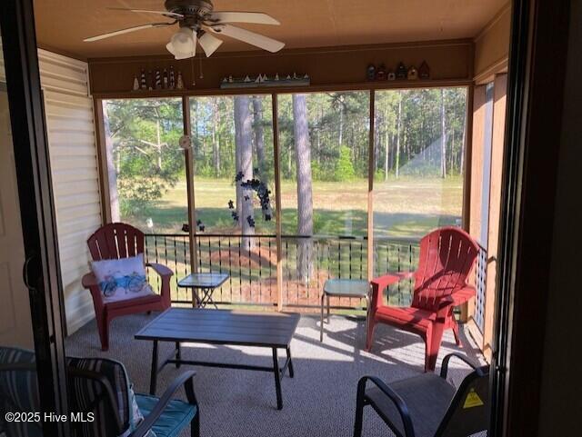 202 Country Club Villa Dr # 2, Shallotte, NC 28470 - sunroom featuring ceiling fan, carpet, and healthy amount of natural light