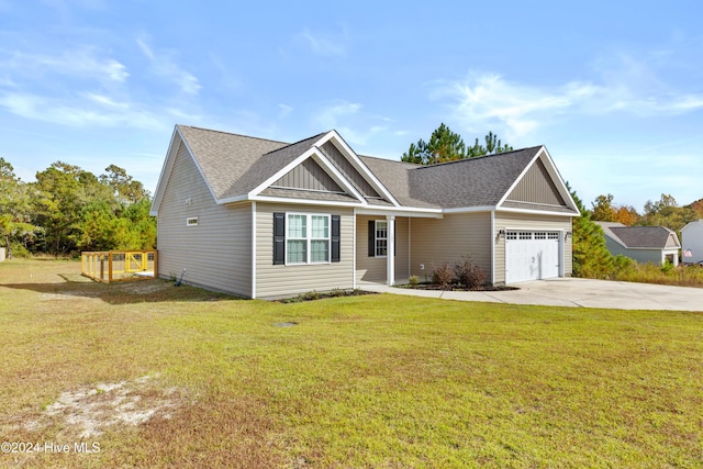 view of front of home featuring a front lawn and a garage