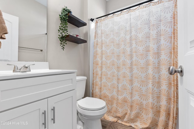 bathroom with vanity, toilet, and tile walls