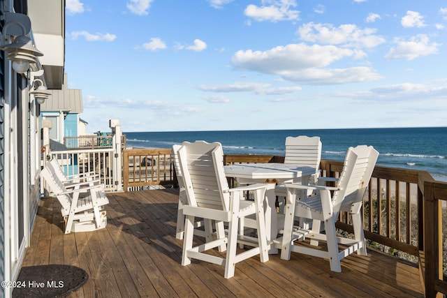 deck featuring a water view and a view of the beach