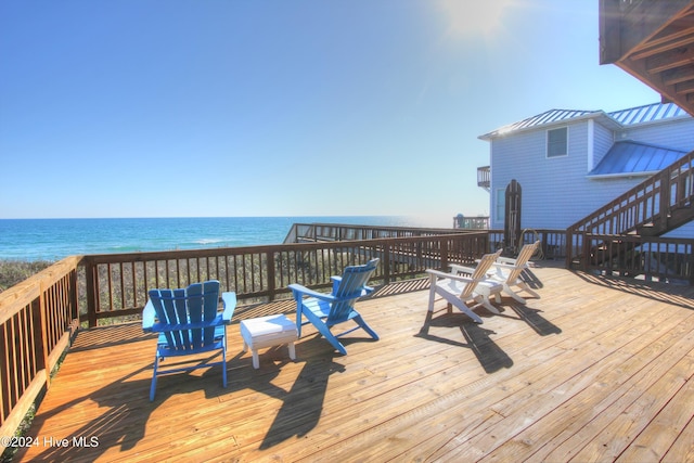 wooden deck featuring a water view