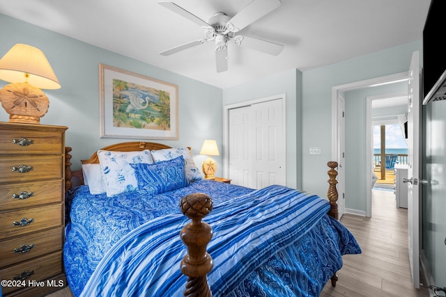 bedroom with ceiling fan, a closet, and light hardwood / wood-style flooring