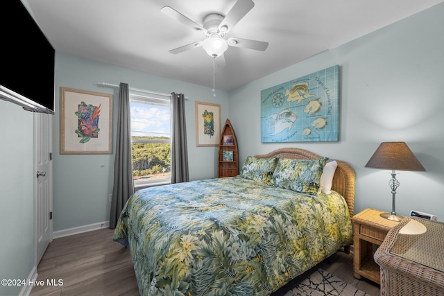 bedroom featuring hardwood / wood-style flooring and ceiling fan