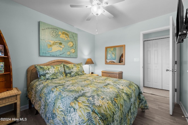 bedroom with ceiling fan, wood-type flooring, and a closet