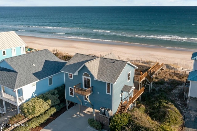 bird's eye view featuring a beach view and a water view