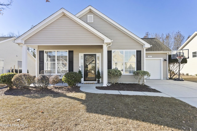 view of front facade featuring a porch and a garage