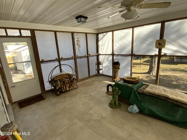 sunroom / solarium featuring ceiling fan