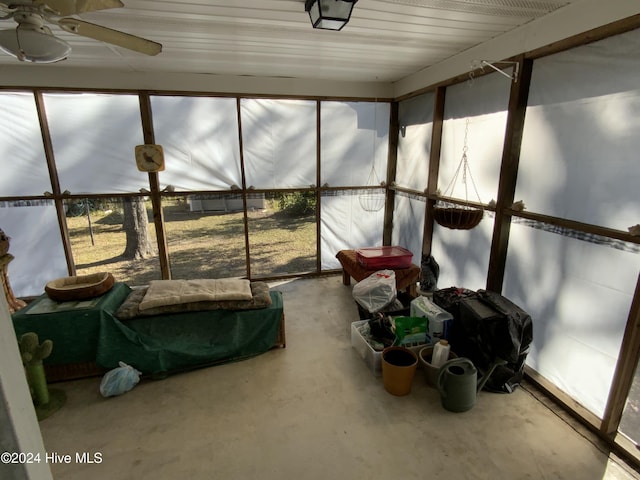 sunroom with ceiling fan and a healthy amount of sunlight