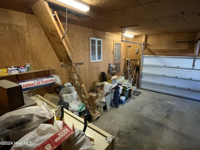 garage featuring wood walls