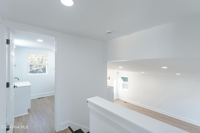 hallway with light wood-type flooring