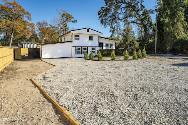 back of house with a garage