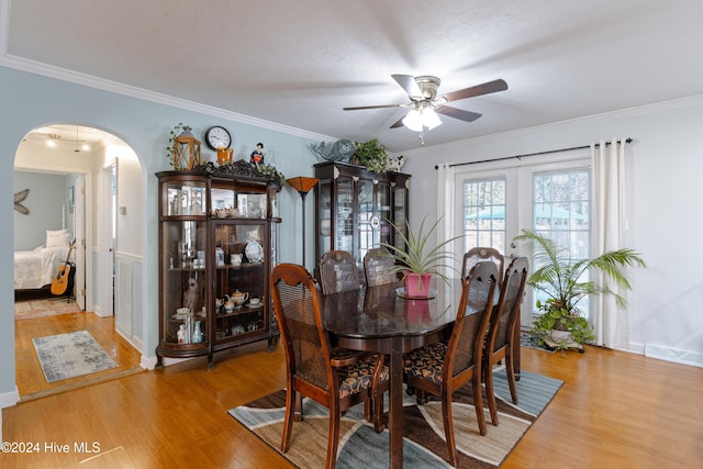 dining area featuring hardwood / wood-style floors and ornamental molding