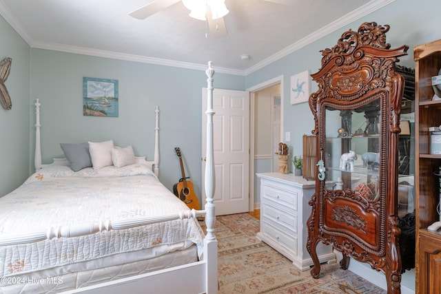 bedroom with ceiling fan and ornamental molding