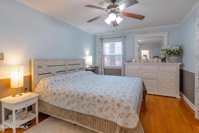 bedroom with ceiling fan, crown molding, and light hardwood / wood-style flooring