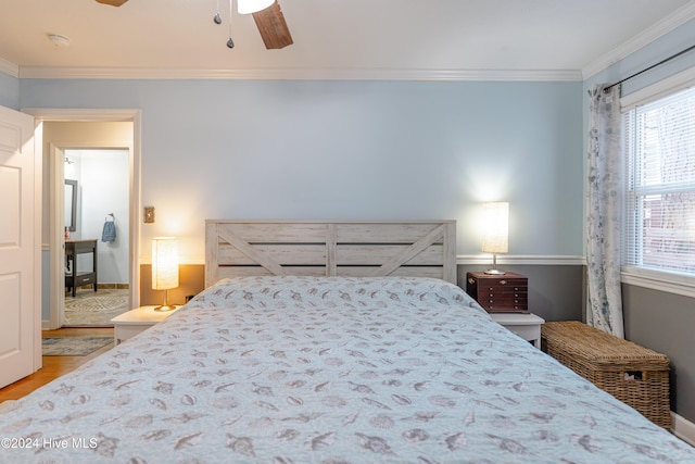 bedroom with light wood-type flooring, ceiling fan, and ornamental molding