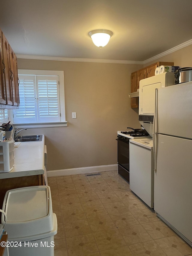 kitchen featuring white appliances, ornamental molding, and sink