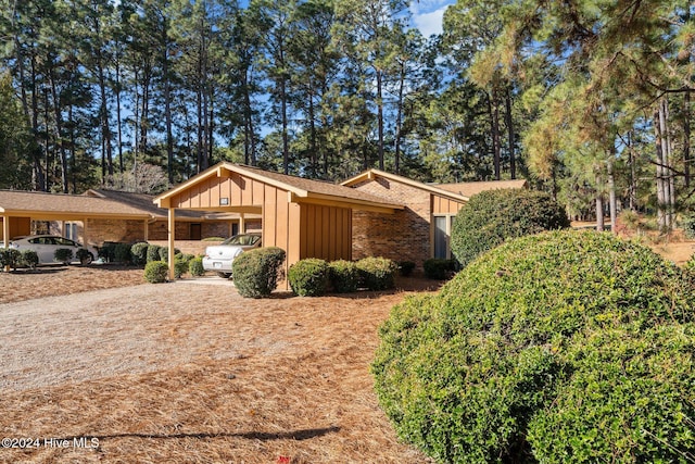 view of side of property featuring a carport