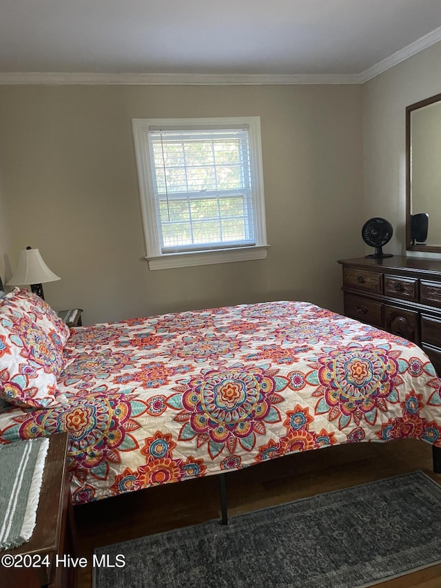 bedroom featuring crown molding