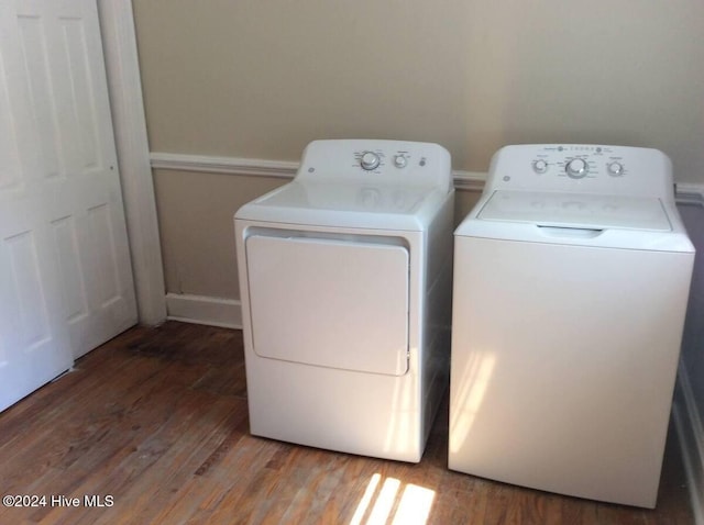 laundry room featuring washer and clothes dryer and hardwood / wood-style flooring