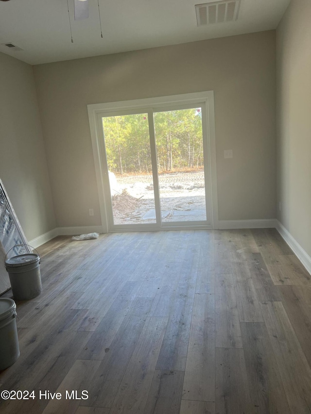 empty room with wood-type flooring