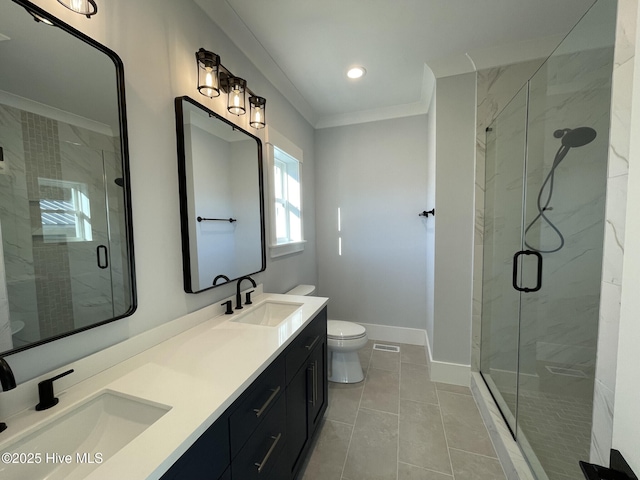 bathroom with crown molding, vanity, toilet, and a shower with shower door