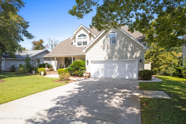 view of front of house with a porch, a garage, and a front yard