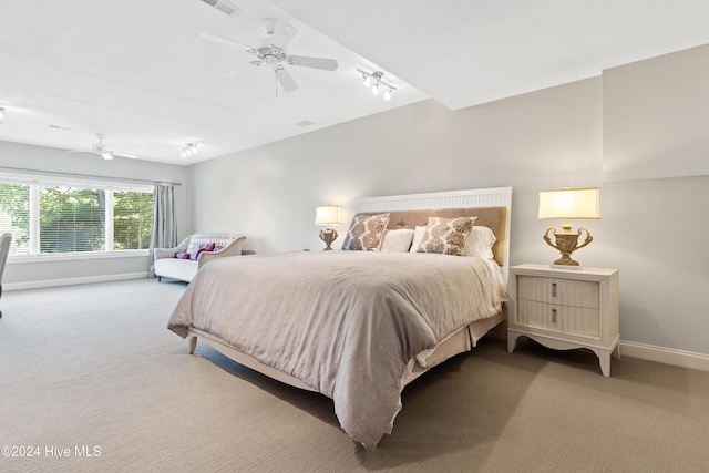 carpeted bedroom with ceiling fan